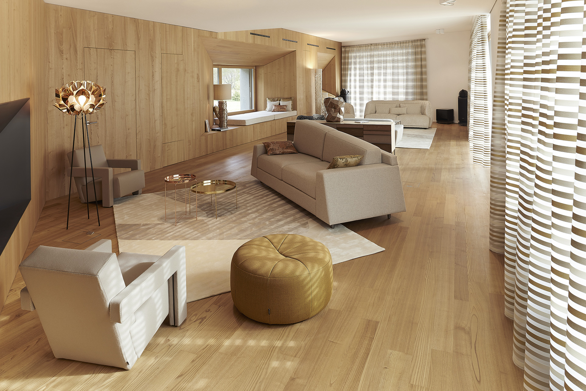 Double salon d’une villa luxueuse dans les Alpes par l’agence Borella Art Design